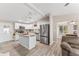 Modern kitchen featuring white cabinets, stainless steel appliances, and granite countertops at 1404 Torrey Pines Dr, The Villages, FL 32159