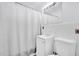 Clean bathroom, white tile, shower/tub combo, and vanity at 1412 N Garfield Ave, Deland, FL 32724