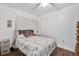 Bedroom with floral bedding and wood-look floors at 1412 N Garfield Ave, Deland, FL 32724