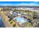 Community pool with a gazebo and lush landscaping at 16792 Meadows St, Clermont, FL 34714