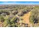 Aerial view of a park with walking paths and lush trees at 16792 Meadows St, Clermont, FL 34714