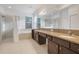 Main bathroom with double vanity, shower, and garden tub at 16792 Meadows St, Clermont, FL 34714