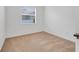 Well-lit bedroom featuring neutral walls and carpet at 16792 Meadows St, Clermont, FL 34714