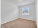 Bright bedroom with neutral carpeting and window blinds at 16792 Meadows St, Clermont, FL 34714