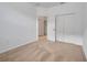 Spacious bedroom with neutral walls and carpeting, double door closet at 16792 Meadows St, Clermont, FL 34714