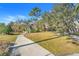 Paved pathway with benches and landscaping at 16792 Meadows St, Clermont, FL 34714