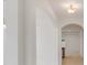 Arched hallway with tile flooring connecting rooms at 16792 Meadows St, Clermont, FL 34714
