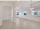 Bright and airy living area with tile flooring at 16792 Meadows St, Clermont, FL 34714