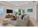 Bright and airy living room with neutral furniture and access to backyard at 16792 Meadows St, Clermont, FL 34714