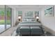 Main bedroom with access to backyard, featuring stylish decor at 16792 Meadows St, Clermont, FL 34714