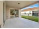 Covered patio with sliding glass doors at 16792 Meadows St, Clermont, FL 34714