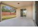 Covered patio with sliding glass doors and view of backyard at 16792 Meadows St, Clermont, FL 34714