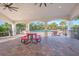 Covered patio area overlooking the community pool at 16792 Meadows St, Clermont, FL 34714