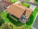 Aerial view of the property with a screened-in patio and backyard at 17412 Se 76Th Flintlock Ter, The Villages, FL 32162