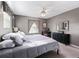Cozy bedroom filled with natural light featuring a full mirror, and a comforting bed at 17412 Se 76Th Flintlock Ter, The Villages, FL 32162