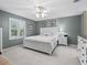 Serene bedroom with a ceiling fan, natural light from the window, and neutral decor at 17412 Se 76Th Flintlock Ter, The Villages, FL 32162