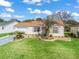 Charming single-Gathering home featuring an attached two car garage, landscaping, and an inviting front yard at 17412 Se 76Th Flintlock Ter, The Villages, FL 32162