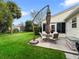Outdoor patio featuring a dining set and cantilevered umbrella, perfect for relaxing outdoors at 17412 Se 76Th Flintlock Ter, The Villages, FL 32162
