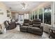 Bright and airy sunroom featuring tiled floors, comfortable seating, and large windows with outdoor views at 17412 Se 76Th Flintlock Ter, The Villages, FL 32162