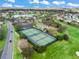 Aerial view of well-maintained community tennis courts at 17412 Se 76Th Flintlock Ter, The Villages, FL 32162