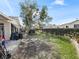 Large backyard with grassy area and space for outdoor activities at 17744 Se 95Th Ct, Summerfield, FL 34491