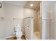 Modern bathroom with a large walk-in shower and toilet at 17744 Se 95Th Ct, Summerfield, FL 34491