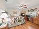 Spacious bedroom with a desk, dresser and ceiling fan at 17744 Se 95Th Ct, Summerfield, FL 34491