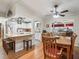 Open dining area with wood table and chairs, adjacent to the kitchen at 17744 Se 95Th Ct, Summerfield, FL 34491