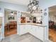Bright kitchen with white cabinets, granite countertops, and stainless steel appliances at 17744 Se 95Th Ct, Summerfield, FL 34491