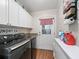 Laundry room with washer, dryer, and ample cabinet space at 17744 Se 95Th Ct, Summerfield, FL 34491