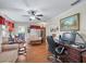 Home office with built-in wooden shelving and rocking chair at 17744 Se 95Th Ct, Summerfield, FL 34491