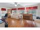 Sunlit home office space with hardwood floors and large windows at 17744 Se 95Th Ct, Summerfield, FL 34491