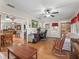 Bright home office with hardwood floors, and view into dining area at 17744 Se 95Th Ct, Summerfield, FL 34491