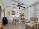 Sunroom with tiled floor, seating area, and a table for dining at 17744 Se 95Th Ct, Summerfield, FL 34491