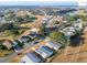 Wide aerial view of community near golf course and lake at 1783 W Schwartz Blvd, Lady Lake, FL 32159