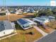 Aerial view showing a manufactured home and surrounding neighborhood at 1783 W Schwartz Blvd, Lady Lake, FL 32159