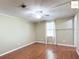 Bright bedroom with wood flooring and ceiling fan at 1783 W Schwartz Blvd, Lady Lake, FL 32159