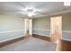 Bright bedroom with wood floors and ceiling fan at 1783 W Schwartz Blvd, Lady Lake, FL 32159