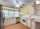 Kitchen with stainless steel appliances and light wood cabinets at 1783 W Schwartz Blvd, Lady Lake, FL 32159