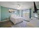 Spacious bedroom with a comfortable bed and coastal decor at 2001 Cristo Rd, Lady Lake, FL 32159