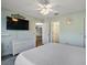 Main bedroom with large TV and dresser, coastal decor at 2001 Cristo Rd, Lady Lake, FL 32159