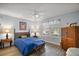 Bright bedroom with a comfortable bed and window coverings at 2001 Cristo Rd, Lady Lake, FL 32159