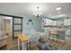 Charming dining area with a wooden table and beachy decor at 2001 Cristo Rd, Lady Lake, FL 32159