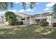 Cute one-story home with landscaped lawn and walkway at 2001 Cristo Rd, Lady Lake, FL 32159