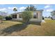 Side view of house showcasing screened porch at 2001 Cristo Rd, Lady Lake, FL 32159