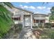 House entrance with walkway and nicely landscaped area at 2001 Cristo Rd, Lady Lake, FL 32159