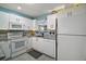 Well-equipped kitchen featuring granite countertops and white cabinets at 2001 Cristo Rd, Lady Lake, FL 32159