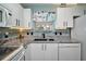 Updated kitchen with granite countertops and white cabinets at 2001 Cristo Rd, Lady Lake, FL 32159