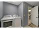 Laundry room with washer and dryer, and access to another room at 2001 Cristo Rd, Lady Lake, FL 32159