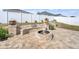 Relaxing backyard patio with fire pit and built-in seating at 2029 Sloans Outlook Dr, Groveland, FL 34736